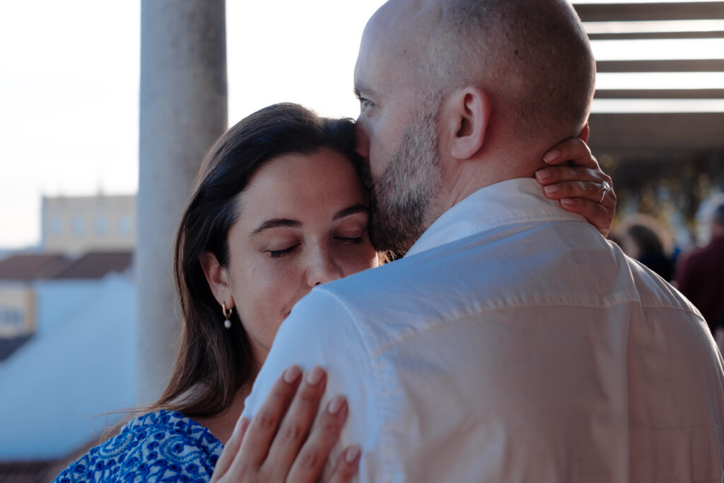 Couple embracing in Lisbon engagement photography