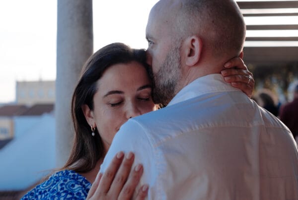 Couple embracing in Lisbon engagement photography